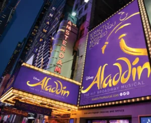 Illuminated marquee sign of Disney's Aladdin at the New Amsterdam Theatre on Broadway