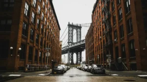 Manhattan Bridge framed by brick buildings on Washington Street in DUMBO Brooklyn